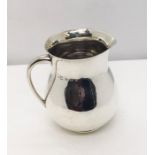 A hallmarked silver jug weight 183.4g