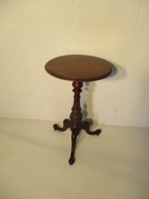 A Victorian tripod occasional table