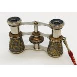 A pair of Victorian opera glasses with foliate decoration in velvet case