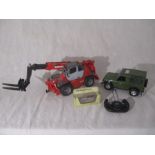 A Jamara remote controlled Land Rover Defender, along with a Brudor Forklift and boxed model of