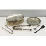 A hallmarked silver brush, dish with 1917 Rupee to centre and sugar nips etc.