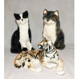 A Babbacombe pottery cat along along with a Price ceramic black and white cat and a ceramic tiger