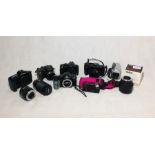 An assortment of various cameras and lenses including Canon, Minolta, Olympus etc.