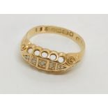 An 18ct boat shaped ring set with diamonds