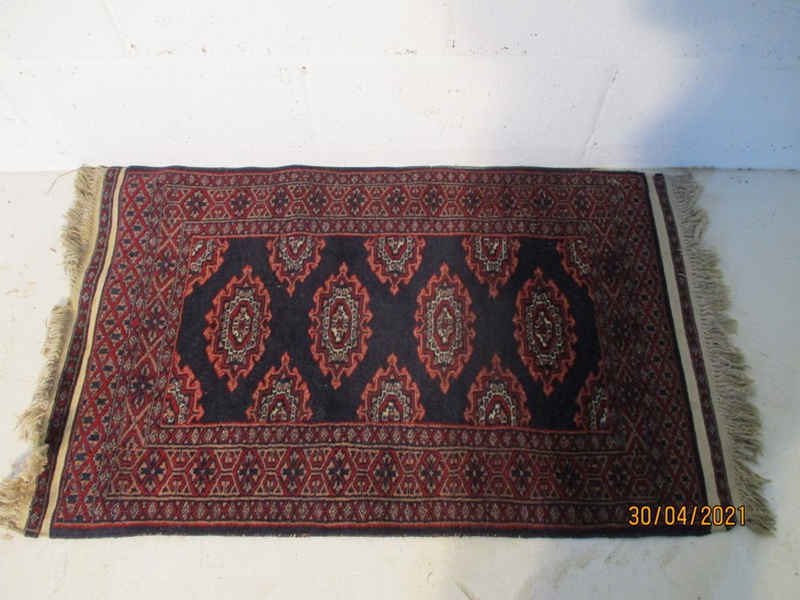 Blue ground rug. 60cm x 94cm