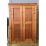 A large pine cupboard H181cm W122cm D53cm