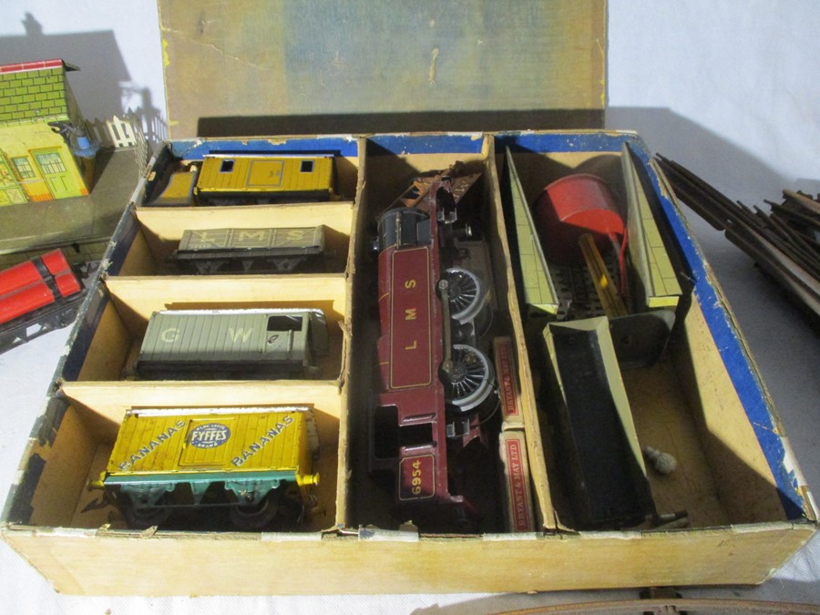 A boxed LNS Hornby train set, loco no. 6954 with various rolling stock etc. Tin plate station,