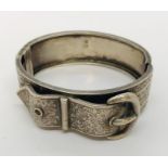 A Victorian hallmarked silver bangle in the form of a buckle