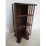 A small revolving bookcase - height 75cm