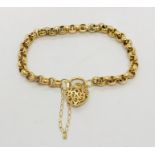 A hallmarked 9 ct gold bracelet with filigree heart shaped padlock, weight 8.7g