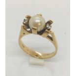 A 10ct gold "courtship" ring set with a pearl