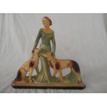 A large vintage plaster figure group of a lady with dogs, height 52.5cm