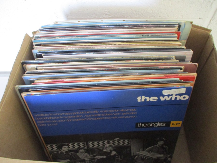 A collection of 12" vinyl records including The Who, John Lennon, Billy Joel, Paul McCartney, Bee