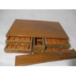 A vintage Mah-jong set in wooden case with incised decoration of junks on a river