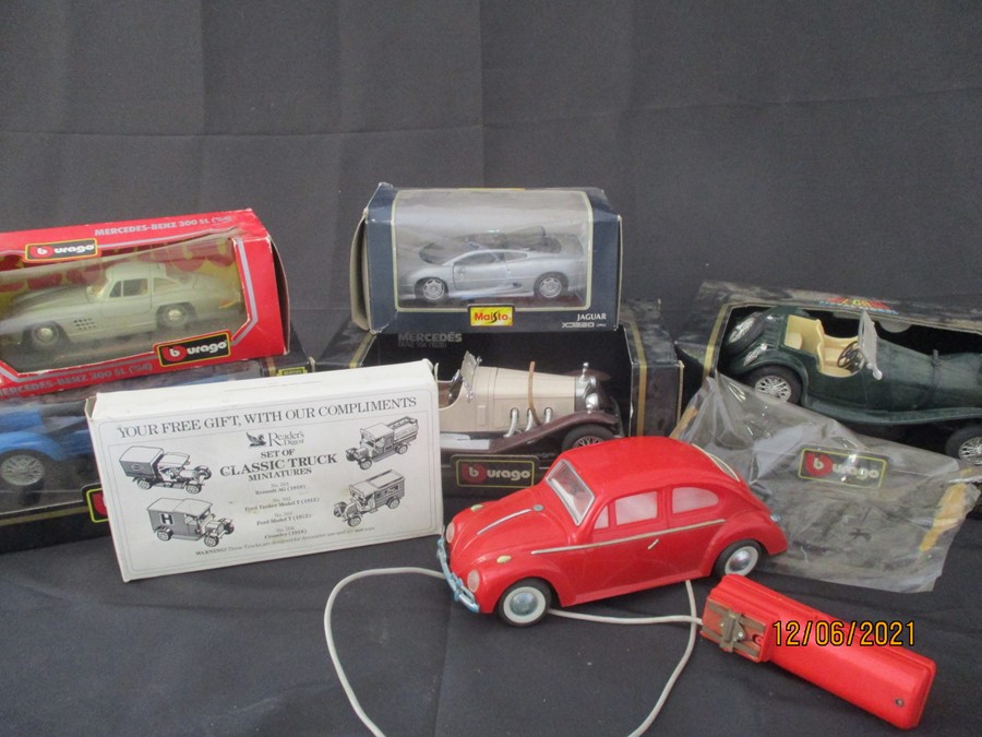 A collection of mainly Burago model cars including Jaguar SS100, a 1928 Mercedes Benz, a type 59