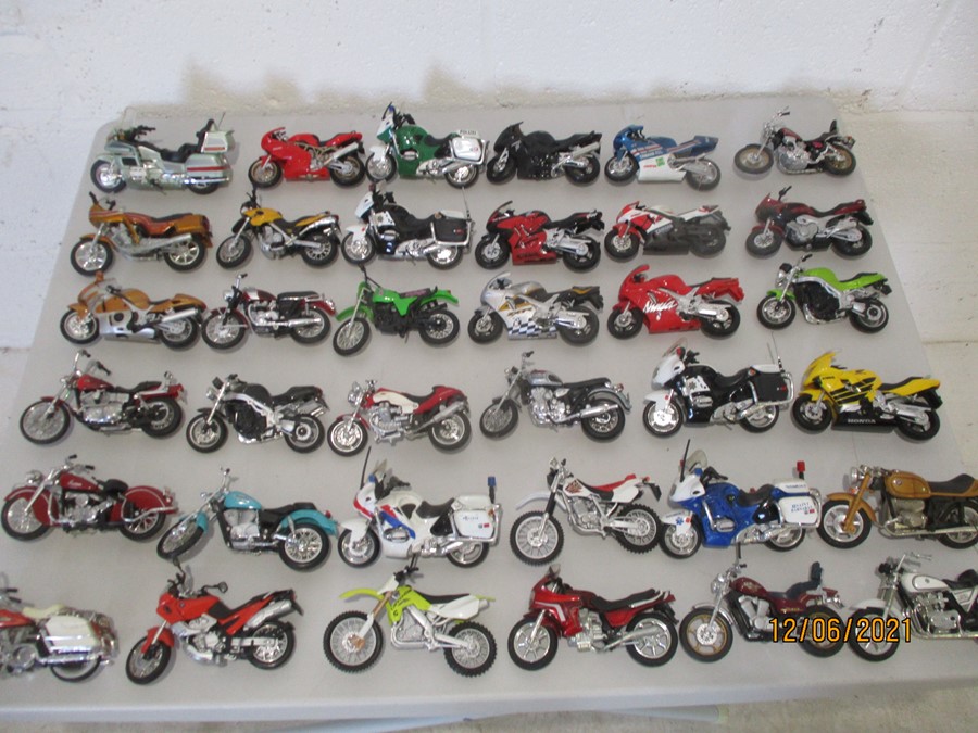 A collection of thirty six model motorcycles including Maisto etc