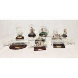 A collection of various subjects in glass bottles and domes including ships etc.