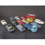 A collection of vintage, play worn die cast Corgi toy cars, plus two Dinky