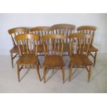 A -harlequin set of seven country style chairs