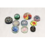 A collection of glass paperweights