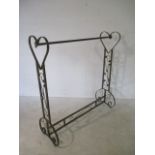 An ornate clothes rail with heart shaped ends