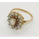 A 9 ct gold opal and garnet cluster ring