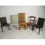 A collection of five various chairs