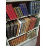 A collection of various books including leather bound volumes