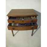 An oak two drawer low bow/ canteen of cutlery with matched silver plated cutlery ( mainly Walker &