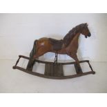A Victorian style wooden rocking horse - overall length 122cm