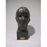 A bronze bust of a child entitled Sabra by Karen Newman (MRSS), dated 1973 - height 37cm