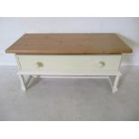 A part painted coffee table with pine top on barley twist legs with one drawer under. Length
