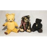 A vintage teddy bear along with two others