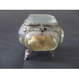 A small French trinket box with glass sides and lid