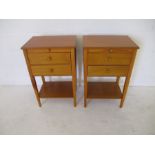 A pair of bedside cabinets