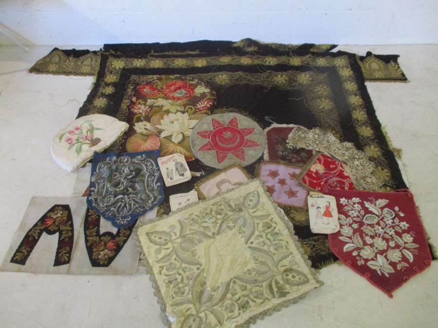 A collection of various linen and beadwork panels, patterns etc