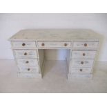 A white painted kneehole desk