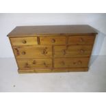 A pine chest of seven drawers