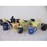 A collection of Wade advertising water jugs