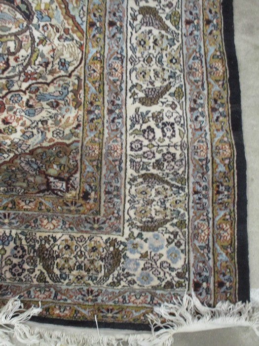 A black ground carpet with floral design, animals etc. approx 12ft x 8ft 10 inches - Image 2 of 8
