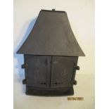 A wood burning stove. Height 85cm