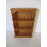 A small pine freestanding bookcase - height 94cm width 61cm