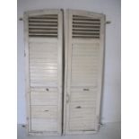 A pair of French white painted shutters.
