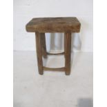 A rustic elm stool