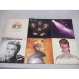 A collection of three David Bowie 12" vinyl records including Aladdin Sane, Low & Changesonebowie,
