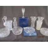A collection of cut and other glassware, including decanters, vases champagne flutes etc