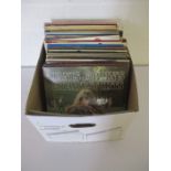 A large collection of 12" vinyl records including Rolling Stones, Bob Dylan, The Who, Dire