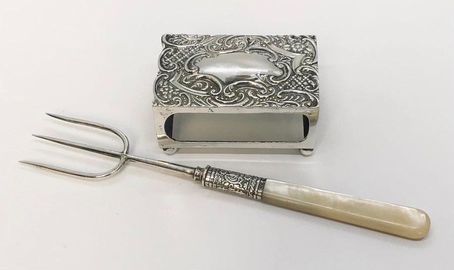 A hallmarked silver matchbox holder along with a silver pickle fork with mother of pearl handle