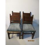 A set of four upholstered oak chairs