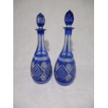 A pair of blue Bohemian glass decanters